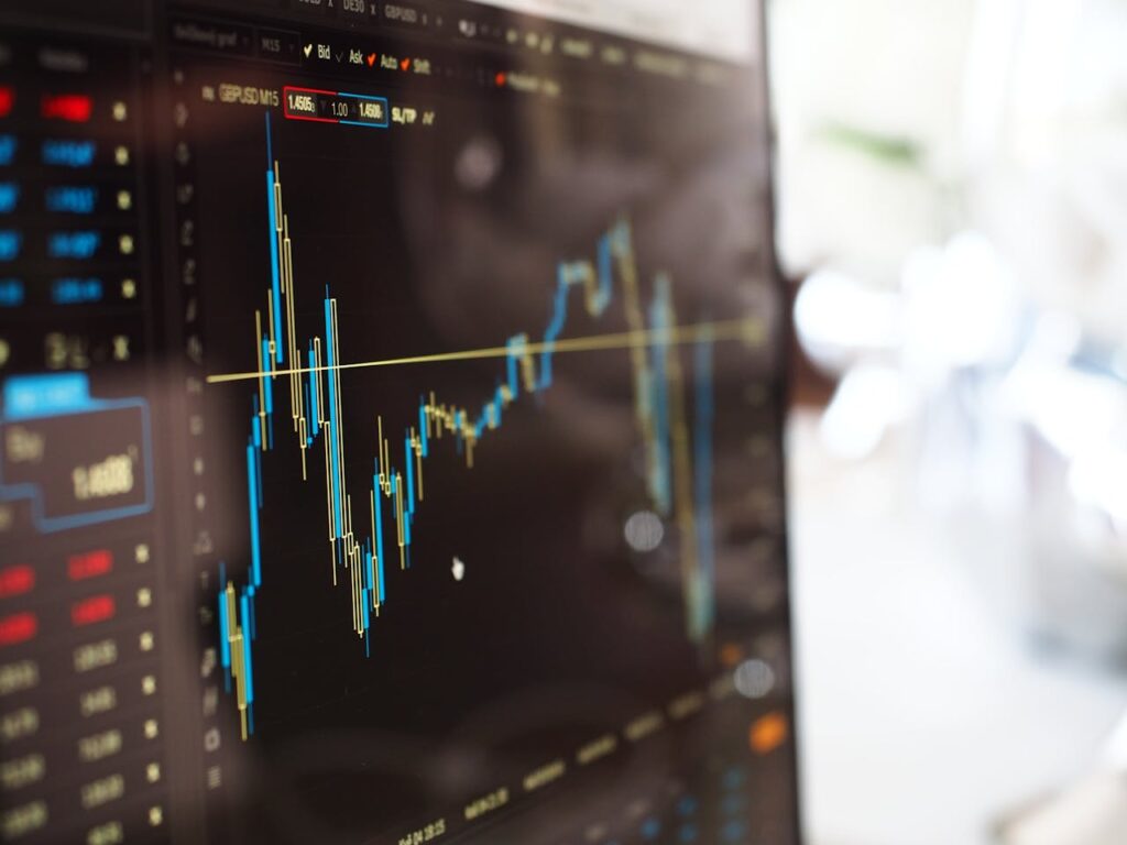 pexels-photo-159888 Detailed view of financial trading graphs on a monitor, illustrating stock market trends.